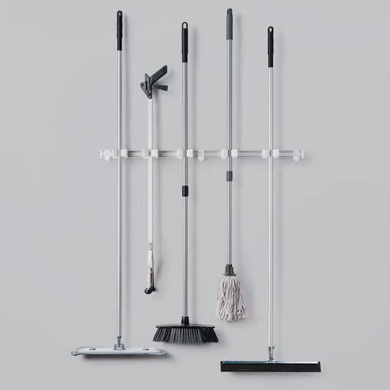Toolflex One assembly showing holders mounted on rail for wall-mounted tool storage system